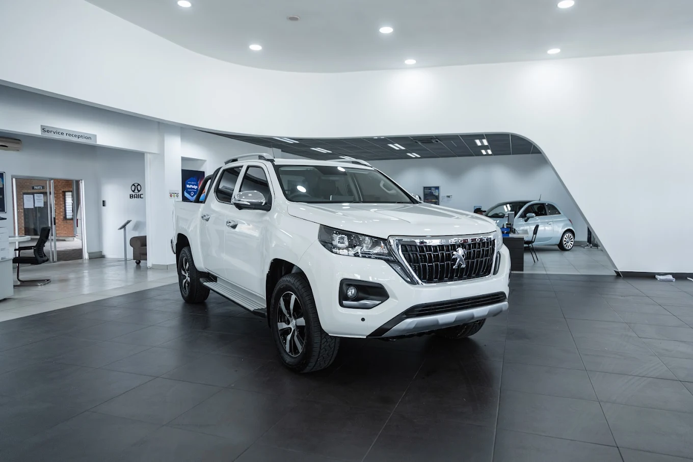Inside the Stellantis Richards Bay showroom with a Peugeot Landtrek on the floor