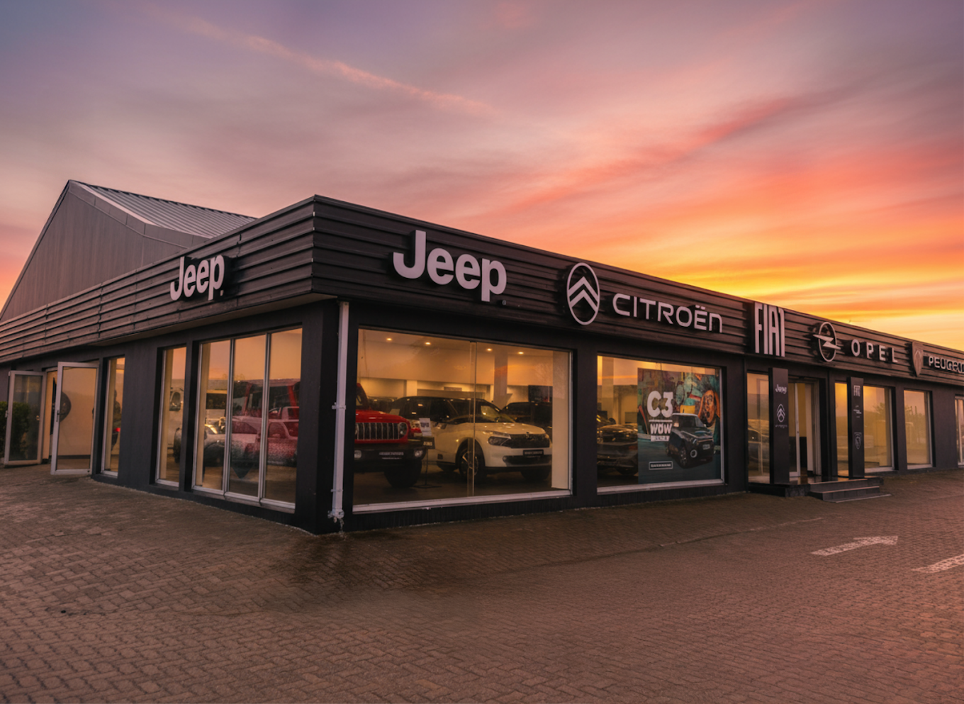 Stellantis Richards Bay dealership at sunset, showing the Jeep, Citroen, Opel and Peugeot brand signage